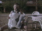 Grace playing the accordian.